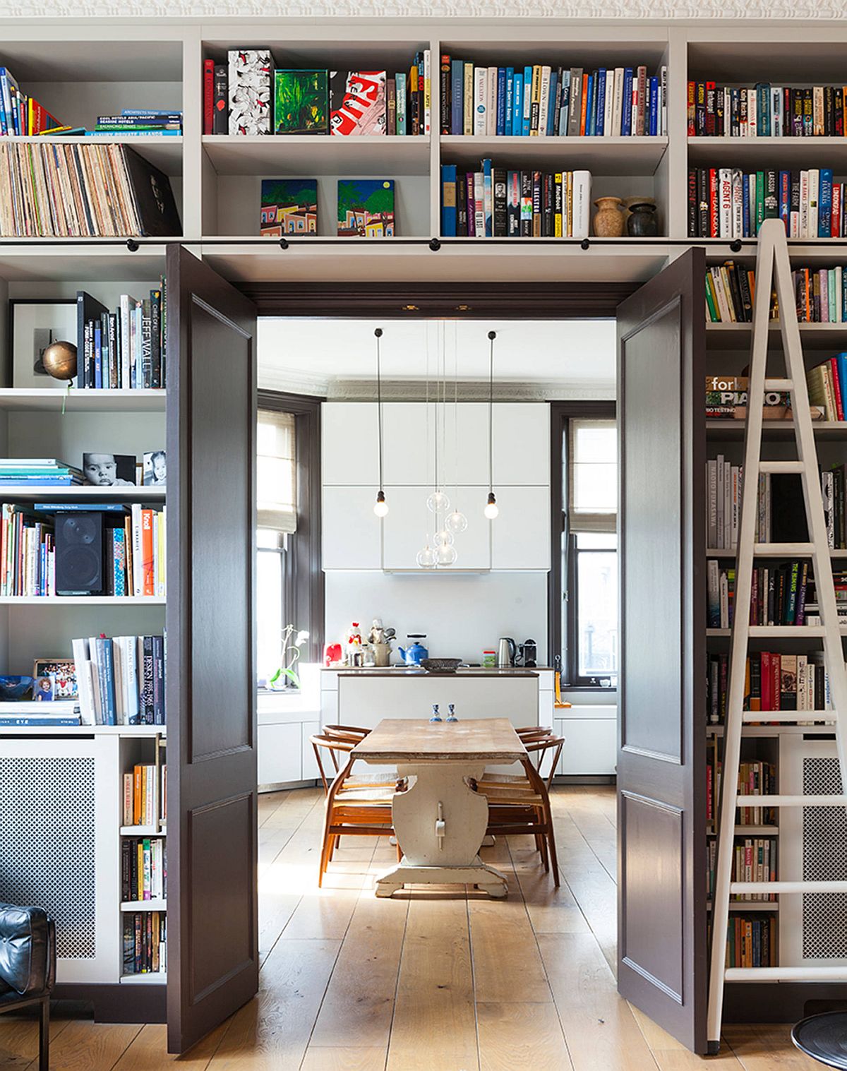 1-doorway-with-built-in-shelves-around-it-delineates-the-kitchen-and-the-doorway