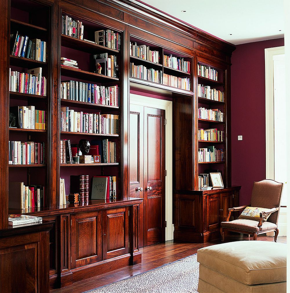 1-french-walnut-shelves-around-the-doorway-along-with-red-walls-shape-a-classic-reading-room