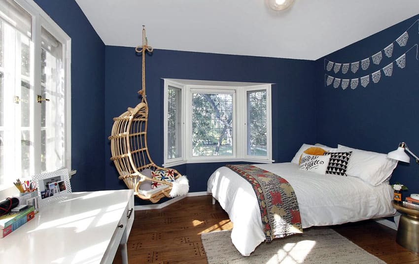 1-teenager-bedroom-with-hanging-rattan-chair-and-blue-walls