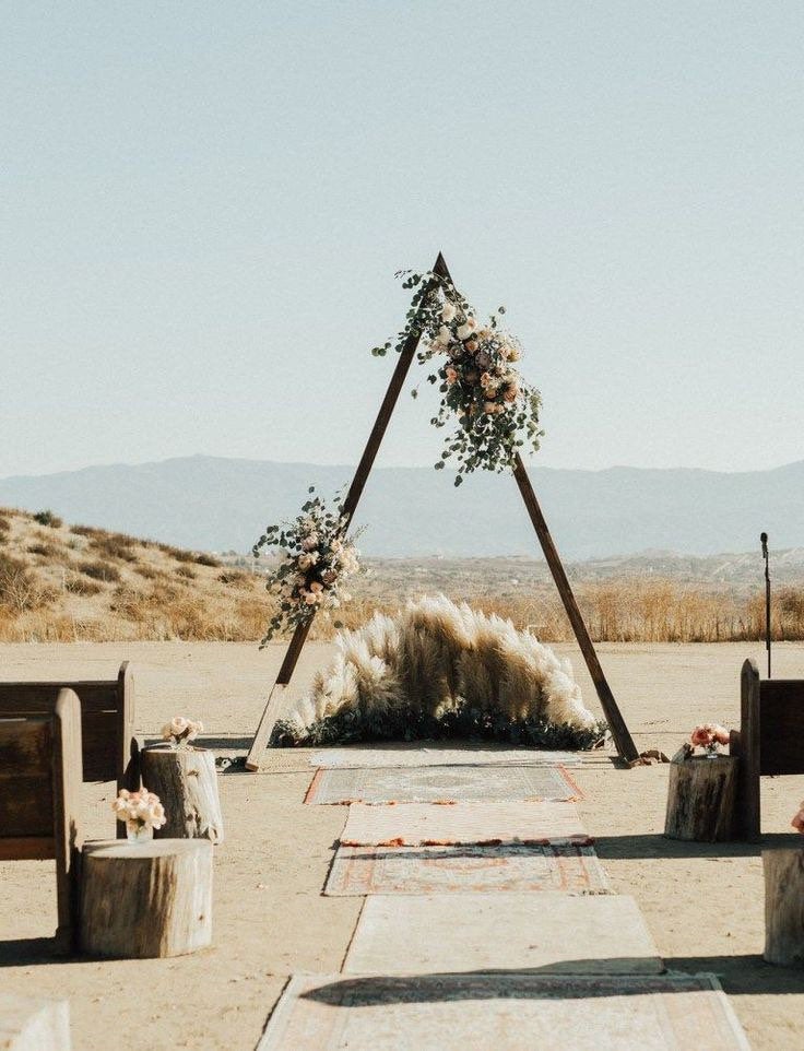 Dramatic-triangular-wedding-arch-from-further-still-71056