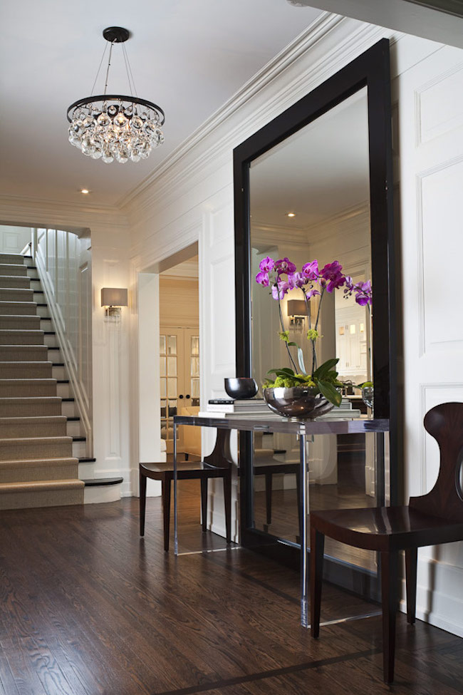 Large-full-length-mirror-with-table-and-chairs-in-entryway