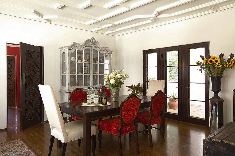 Lovely-hutch-adds-classic-charm-to-the-traditional-dining-space-with-colorful-red-chairs