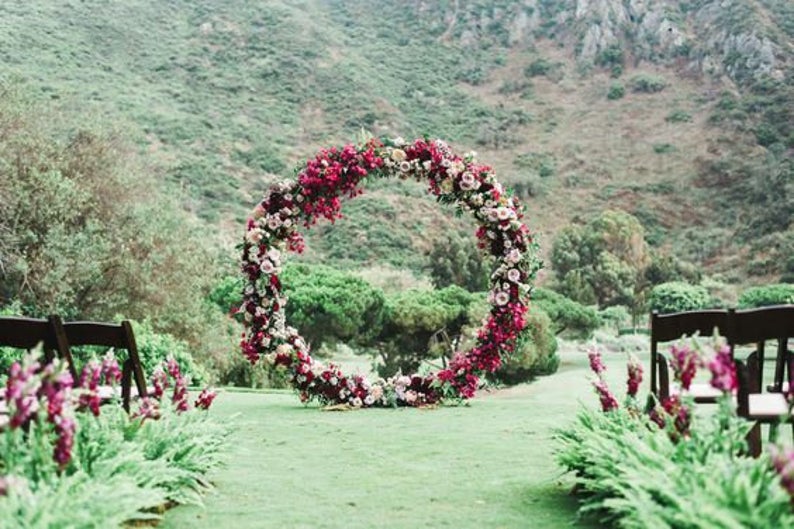 Round-wedding-arch-covered-in-flowers-43953