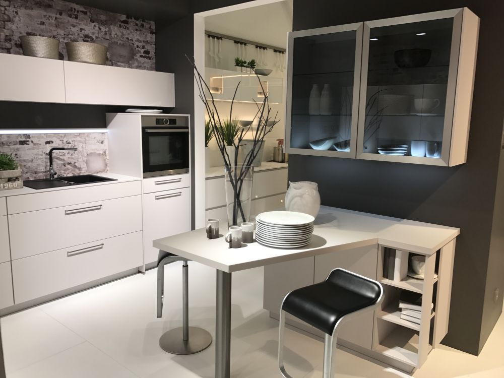 Transparent-kitchen-cabinets-glass-with-small-island-and-black-bar-stools
