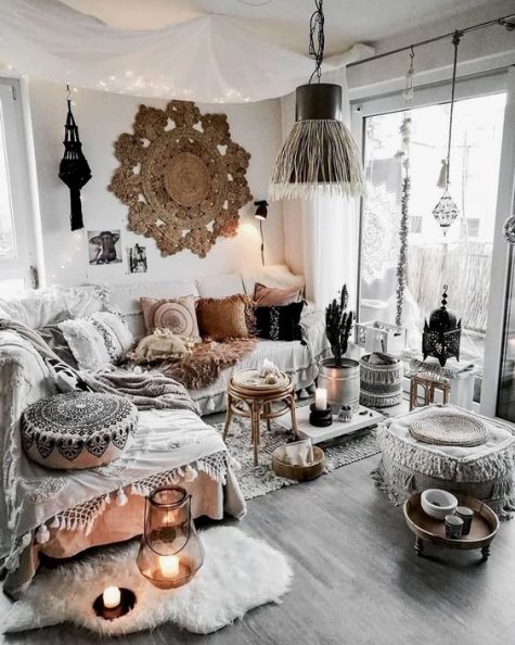 A-neutral-gypsy-space-with-macrame-boho-pillows-rugs-and-ottomans-a-fringe-lamp-and-boho-lamps