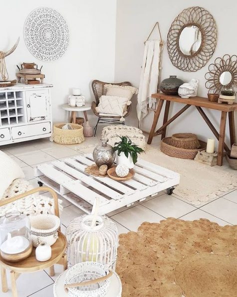 A-whitewashed-boho-living-room-with-shabby-whitewashed-furniture-jute-and-rattan-items-baskets-and-candle-lanterns