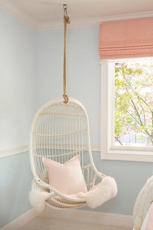 Girls-room-with-corner-white-rattan-hanging-chair
