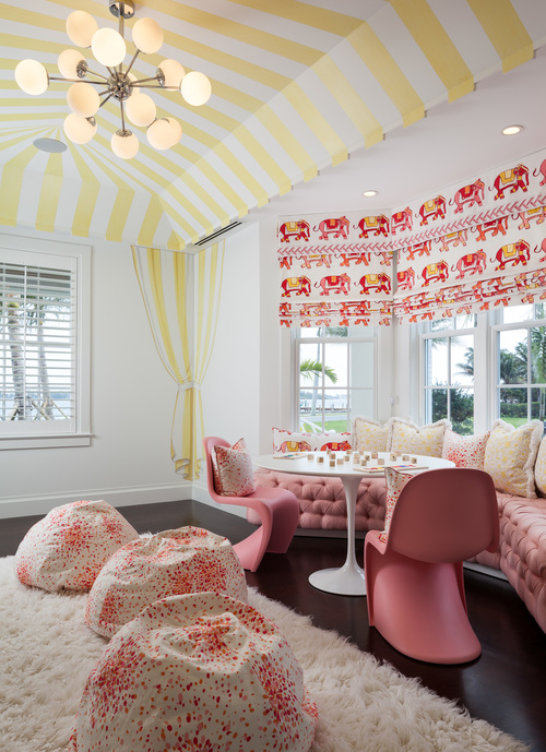 Kids-playroom-canopy-stripe-ceiling-pink-tufted-window-seat-bay-window