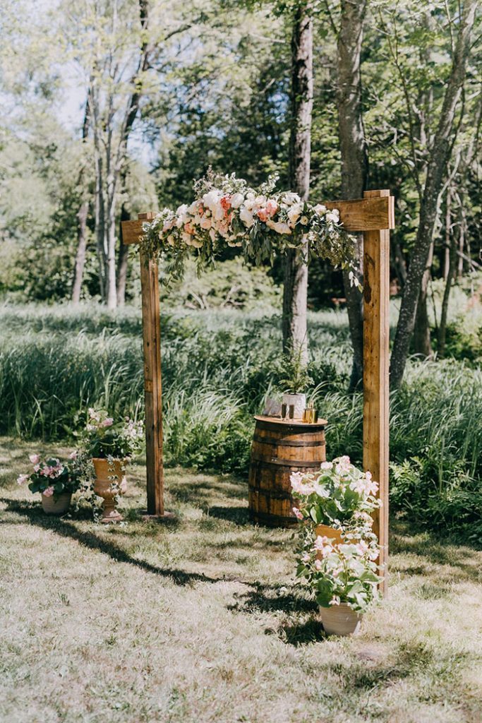 Simple-wood-rustic-wedding-arches-with-flowers-683x1024-1