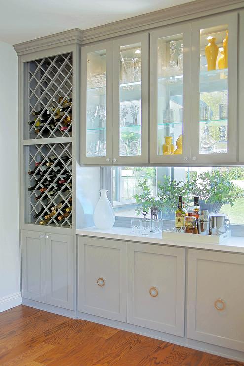 Stacked-wine-racks-see-through-cabinets-gray-bar-design-window-backsplash