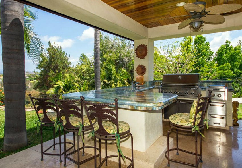 Tropical-outdoor-kitchen-with-granite-counter-peninsula-bar