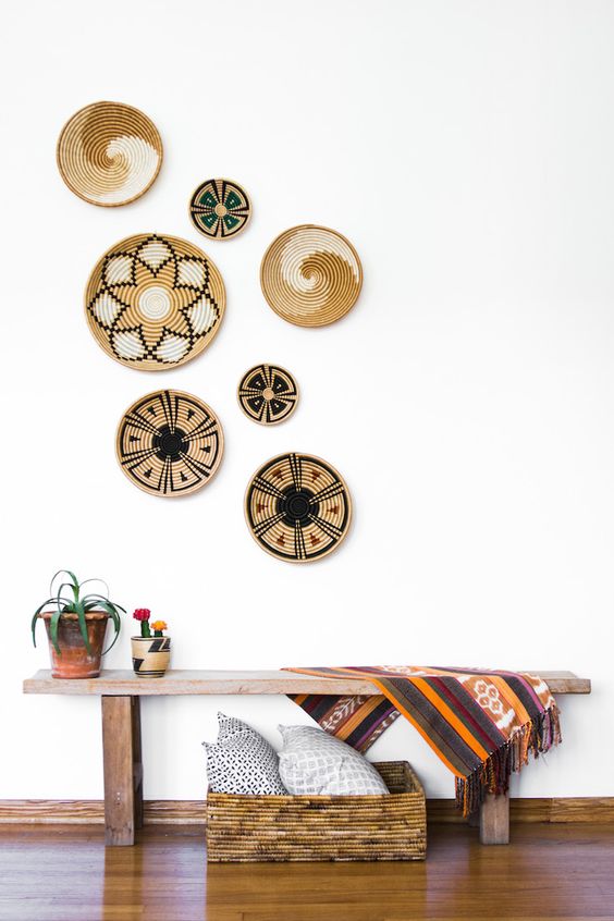 02-style-your-entryway-with-a-colorful-rug-and-painted-wall-baskets-over-the-bench