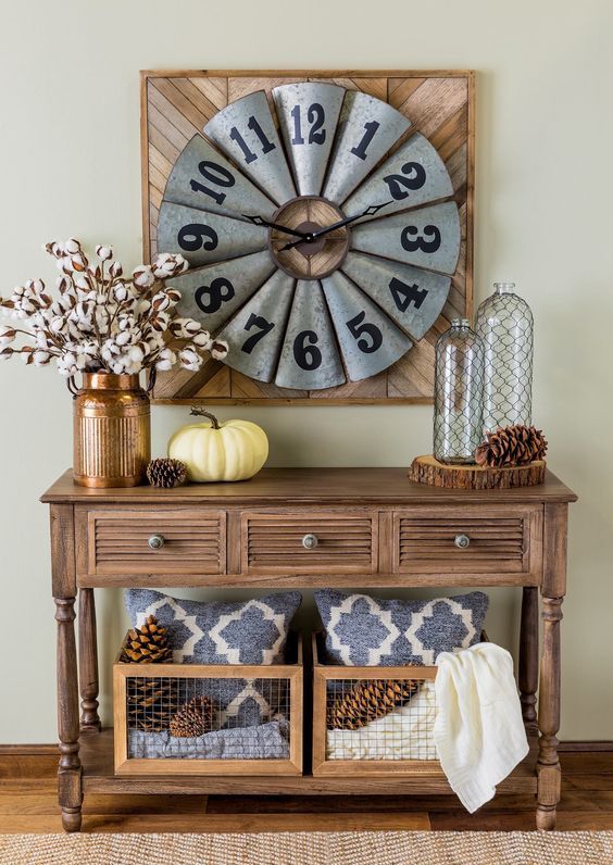 03-a-vintage-wooden-console-table-with-large-pinecones-cotton-branches-in-a-copper-vase-and-wooden-crates-with-pinecones
