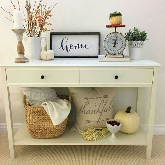 05-simple-fall-styling-with-a-couple-of-pumpkins-berries-greenery-and-a-basket-with-blankets