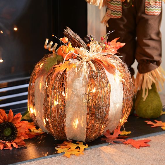 1-04-cute-rattan-pumpkins-with-white-lights-and-a-burlap-bow