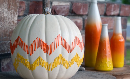 1-candy-corn-chevron-pumpkin-30-pumpkin-decorating-ideas-via-fox-hollow-cottage