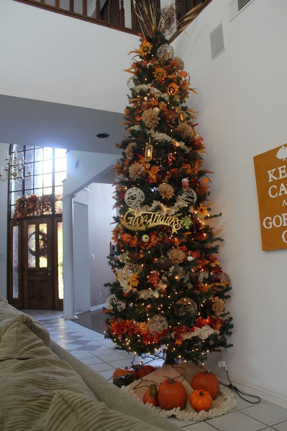 1-a-large-thanksgiving-tree-with-lights-twine-balls-faux-leaves-blooms-grasses-and-fabric-flowers-is-extra-bold