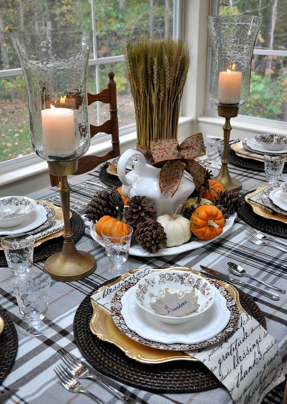 11-pinecones-tiny-pumpkins-and-wheat-for-a-centerpiece-black-woven-chargers-and-a-plaid-tablecloth-and-antique-candle-holders