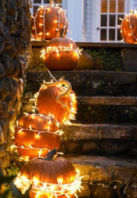 16-brighten-your-traditional-outdoor-decor-by-simply-wrapping-pumpkins-in-string-lights-1