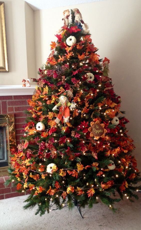 21-a-bold-vintage-inspired-thanksgiving-tree-with-lights-bright-leaves-pumpkins-faux-blooms-and-a-scarecrow