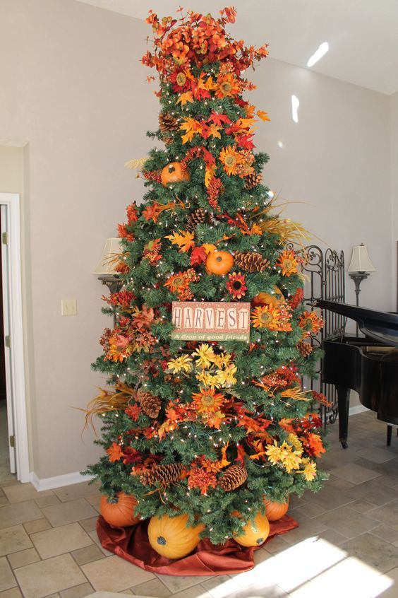 23-a-gorgeous-and-bright-thanksgiving-tree-with-lights-pinecones-bright-faux-blooms-and-leaves-branches-a-sign-and-pumpkins
