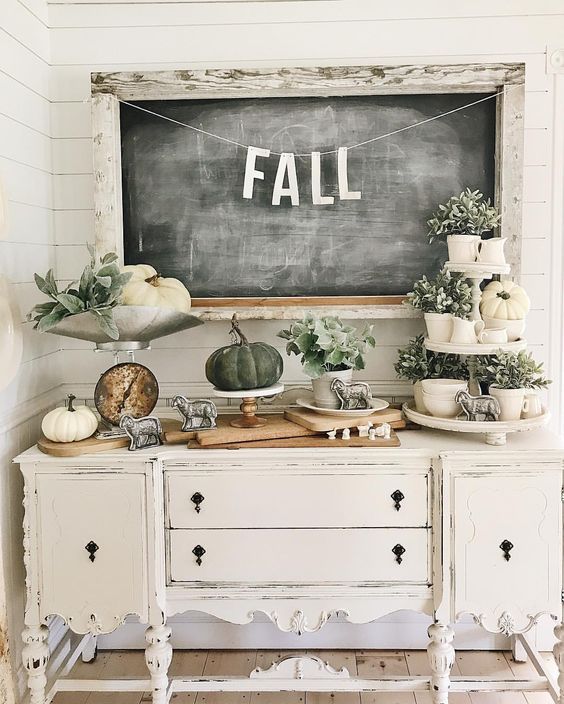 23-a-vintage-carved-console-table-with-white-and-grene-pumpkins-greenery-in-pots-and-vintage-figurines