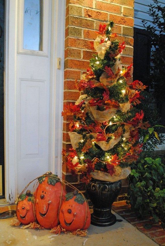 24-a-simple-fall-or-thanksgiving-tree-decorated-with-faux-leaves-burlap-ribbons-and-lights-is-a-stylish-outdoor-decoration