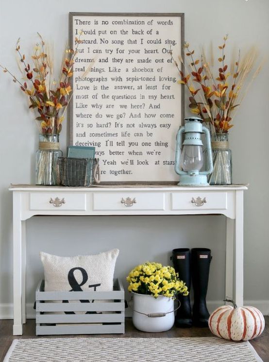 24-a-vintage-console-with-dried-blooms-and-herbs-a-lantern-and-a-natural-pumpkin-on-the-floor