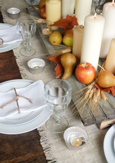 25-board-with-apples-pears-and-candles-on-a-fabric-table-runner