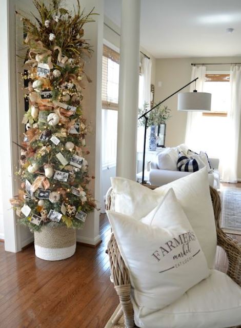 A-thanksgiving-tree-with-white-pumpkins-acorns-leaves-lights-pinecones-grasses-and-family-pics-is-very-cute