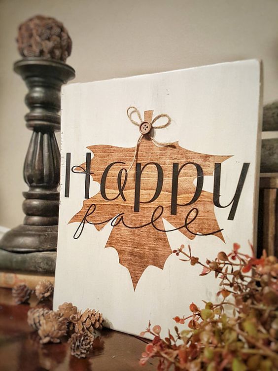 A-beautiful-fall-sign-in-white-and-with-a-stained-fall-leaf-and-a-button-is-super-cute-and-fun