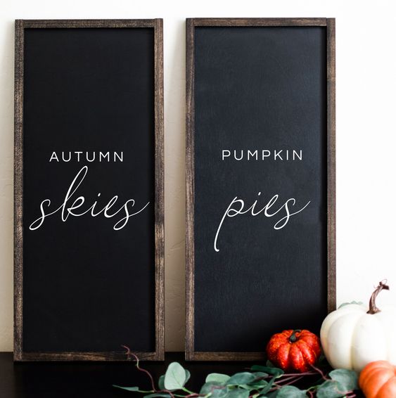 A-duo-of-chalkboard-signs-with-white-letters-is-a-stylish-idea-to-spruce-up-your-mantel-for-the-fall