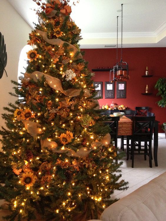 A-fall-tree-decorated-with-lights-leaves-sunflowers-burlap-ribbons-is-a-nice-rustic-decoration-for-thanksgiving