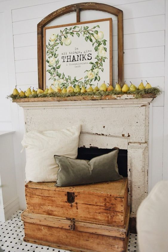 A-harvest-fall-mantel-with-moss-pears-and-a-cool-sign-plus-muted-pillows-on-wooden-boxes