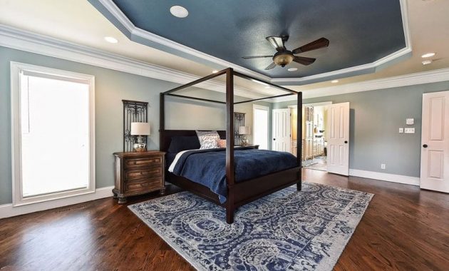 Two-color-blue-bedroom-with-white-trim-painted-tray-ceiling-and-wood-flooring