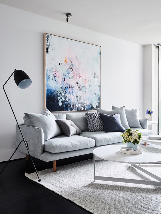 02-a-bold-oversized-artwork-over-the-sofa-is-a-cool-colorful-statement