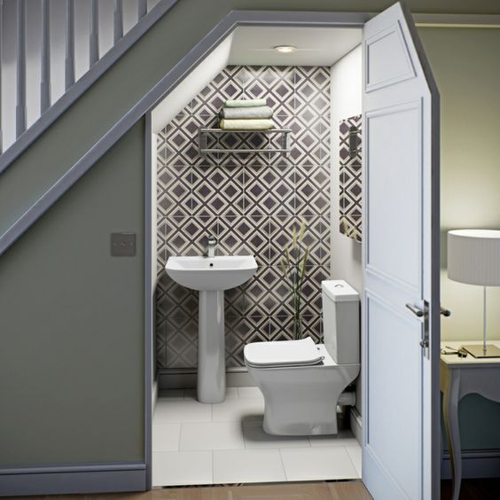 02-a-contemporary-powder-room-done-with-geometric-tiles-a-wall-mounted-shelf-for-storage