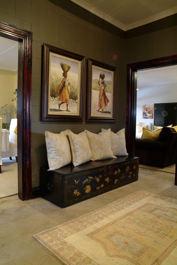 09-a-chest-lined-with-pillows-as-a-mock-bench-for-the-entrance