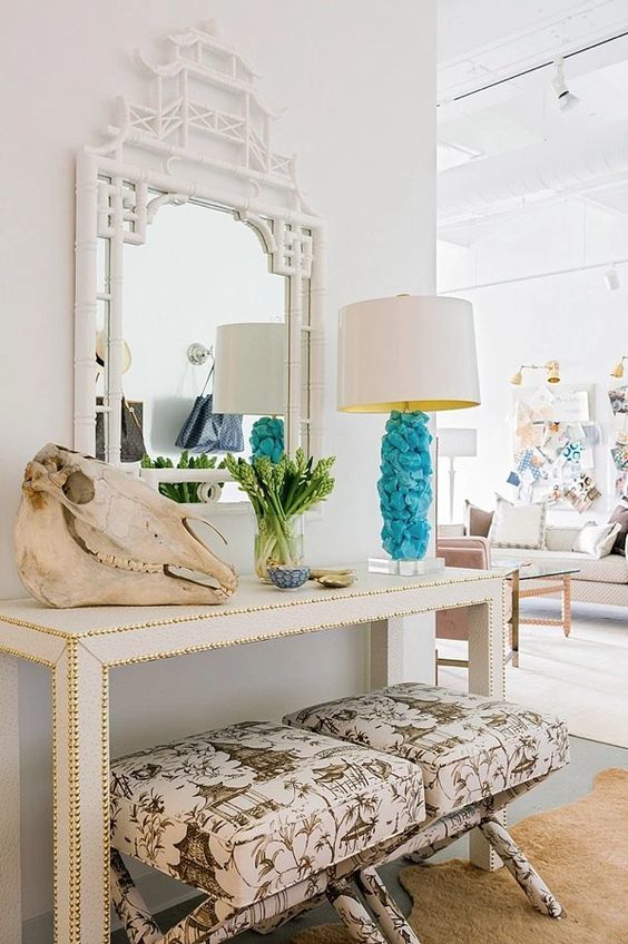 09-a-hammered-console-a-skull-greenery-and-a-creative-blue-rock-lamp-for-a-bright-touch