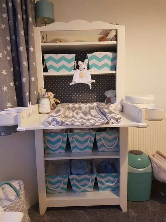 14-a-comfy-changing-table-with-fabric-crates-to-store-diapers-and-other-things