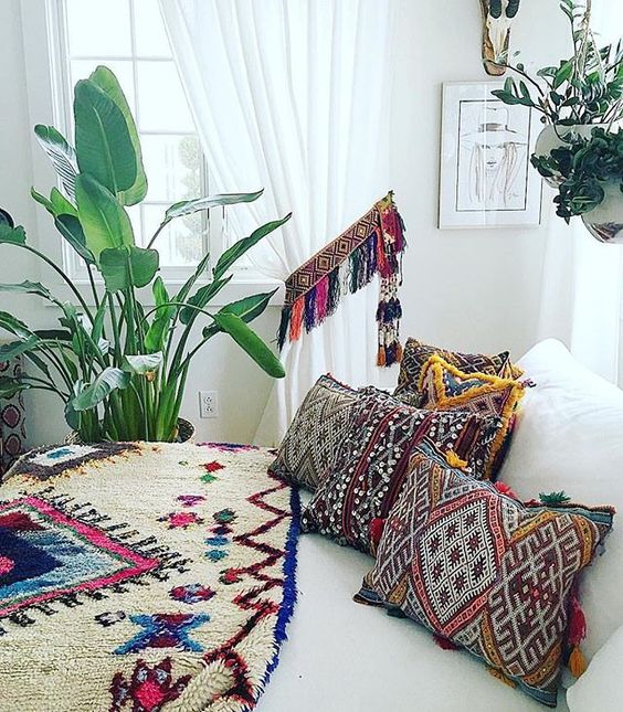14-super-bold-and-colorful-printed-pillows-with-colorful-fringe-and-a-matching-curtain-holder-with-tassels