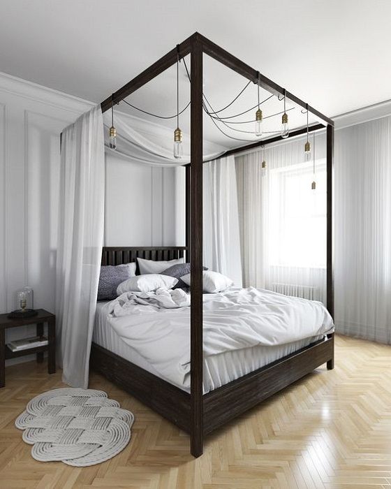 17-a-dark-stained-canopy-bed-with-light-fabric-and-lots-of-bulbs-hanging-on-it-for-additional-light-and-to-make-the-space-more-welcoming