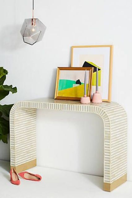 23-a-waterfall-inlay-console-colorful-artworks-and-candle-holders-for-a-mid-century-modenr-interior