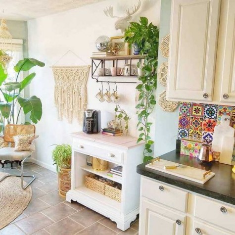 A-boho-chic-kitchen-spruced-up-with-macrame-jute-wicker-and-a-colorful-tile-backsplash-for-a-free-spirited-feel