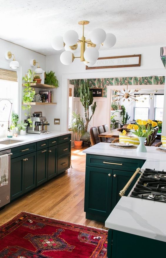 A-bright-boho-kitchen-with-a-colorful-boho-rug-potted-greenery-and-cacti-and-some-mid-century-modern-items