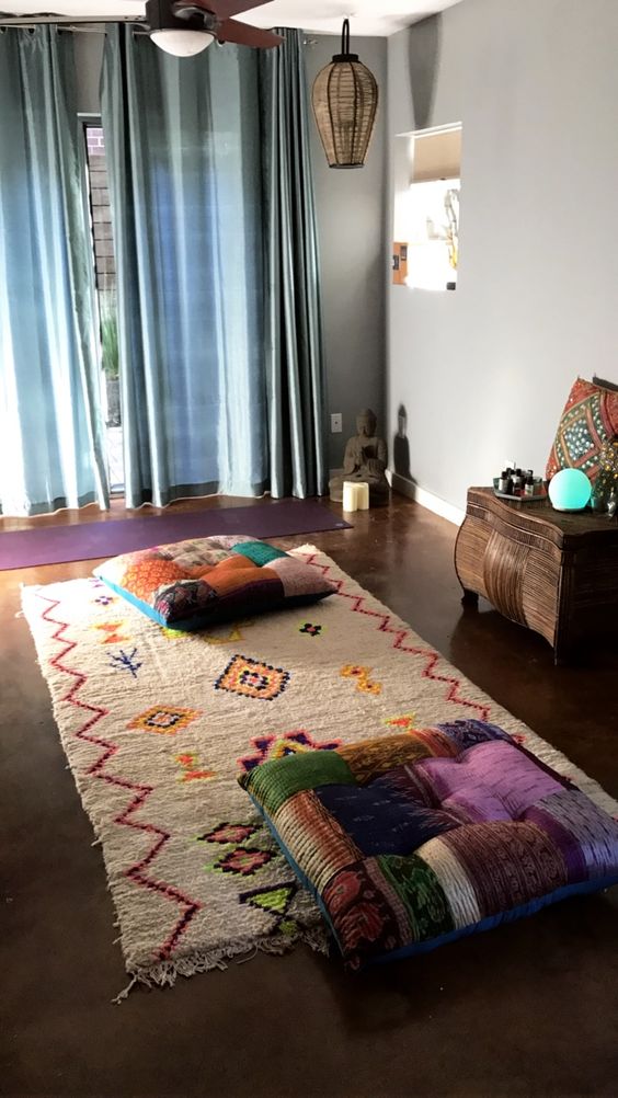 A-colorful-and-boho-meditation-space-with-pillows-a-colorful-rug-and-wicker-lamps