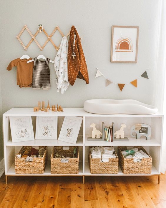 A-large-changing-table-with-woven-boxes-and-open-storage-compartments-for-toys-and-other-stuff