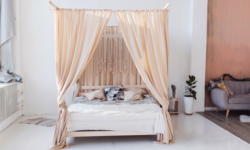 Cosy light bedroom with eco decor. nature concept in interior of room. scandinavian interior, real photo. hygge decoration.modern scandinavian bedroom with bed and plants.