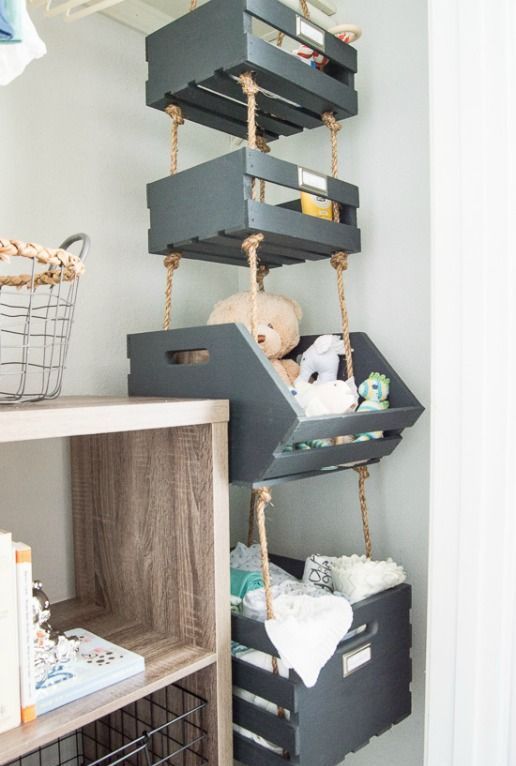 Painted-pallet-boxes-hanging-on-ropes-in-the-corner-provide-much-storage-space-using-the-dead-space-in-the-corner