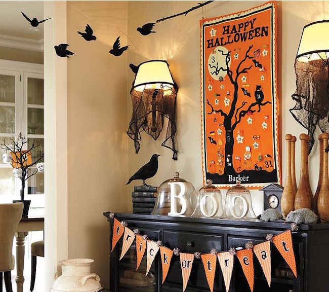Black-fireplace-with-elaborate-halloween-decor-that-extends-above-it